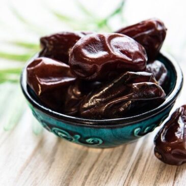 Premium Photo _ Close up of cluster dates palm_ fresh dates palm